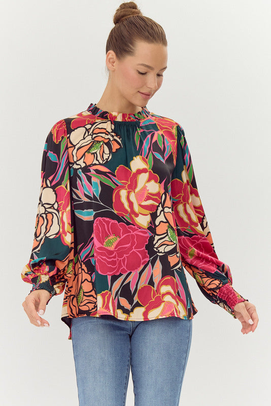 multicolor floral print blouse with ruffle neckline, puff sleeves, and flowy fit
