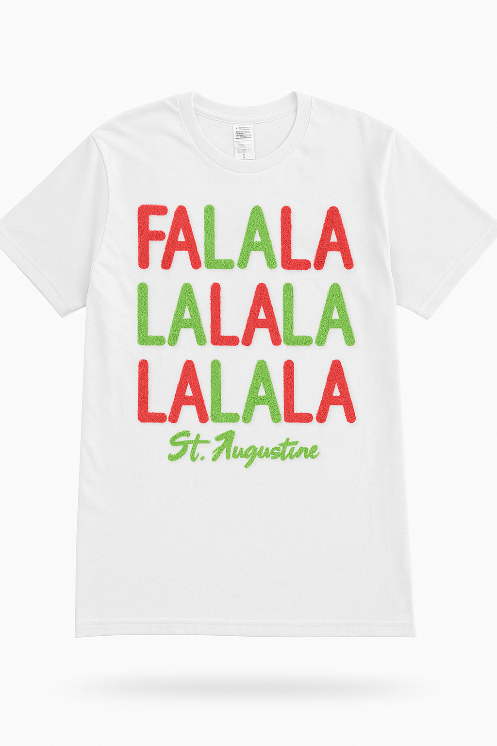White short sleeve tee with fuzzy red and green “Fa La La” lettering and St. Augustine script at the bottom.