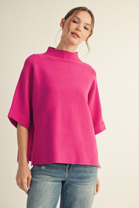 Bright pink mock neck top with short wide sleeves and loose fit