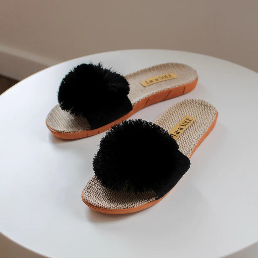 Black Pom Pom Slide Sandals with oversized pom pom and lightweight design