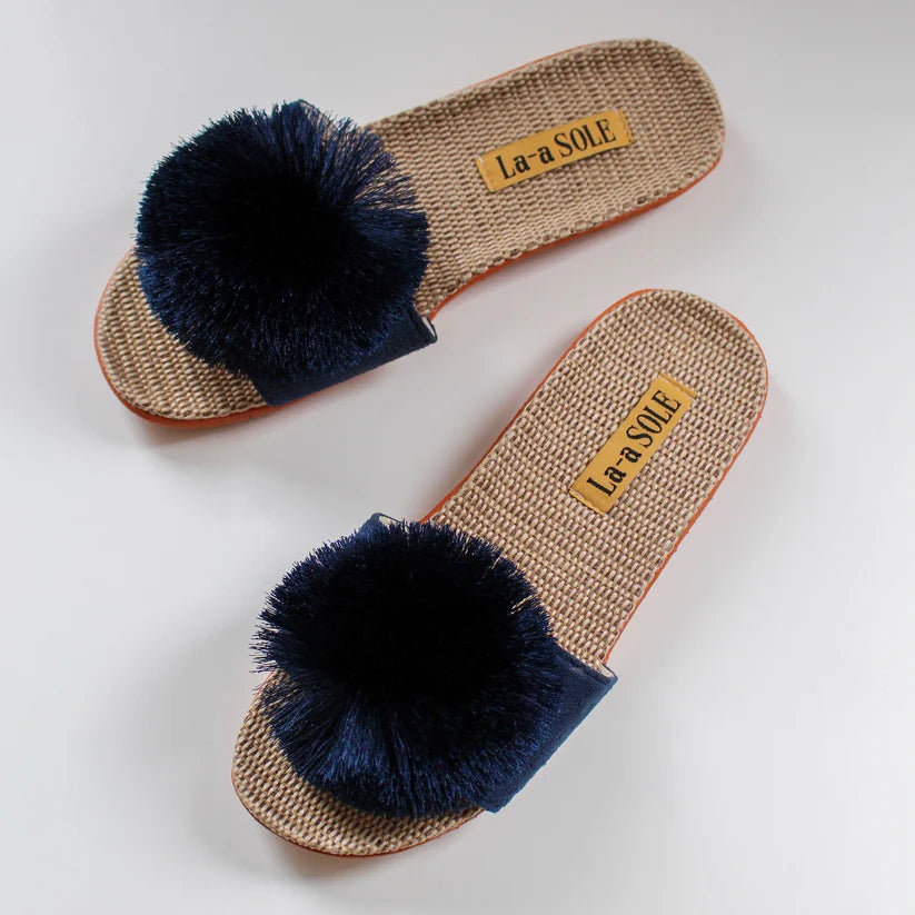Navy Pom Pom Slide Sandals featuring bold pom pom accent and slip-on style