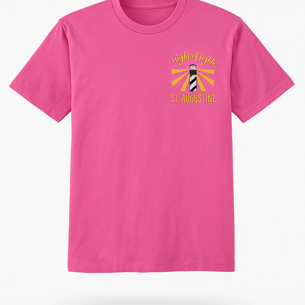 Bright pink short sleeve tee with St. Augustine lighthouse and “Nights of Lights” holiday design in gold and red accents.