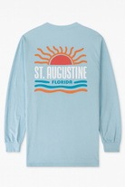 Light blue cotton long sleeve shirt with raised puffy decal design featuring a sunrise, waves, and bold St. Augustine Florida text.