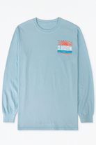 Light blue cotton long sleeve shirt with raised puffy decal design featuring a sunrise, waves, and bold St. Augustine Florida text.