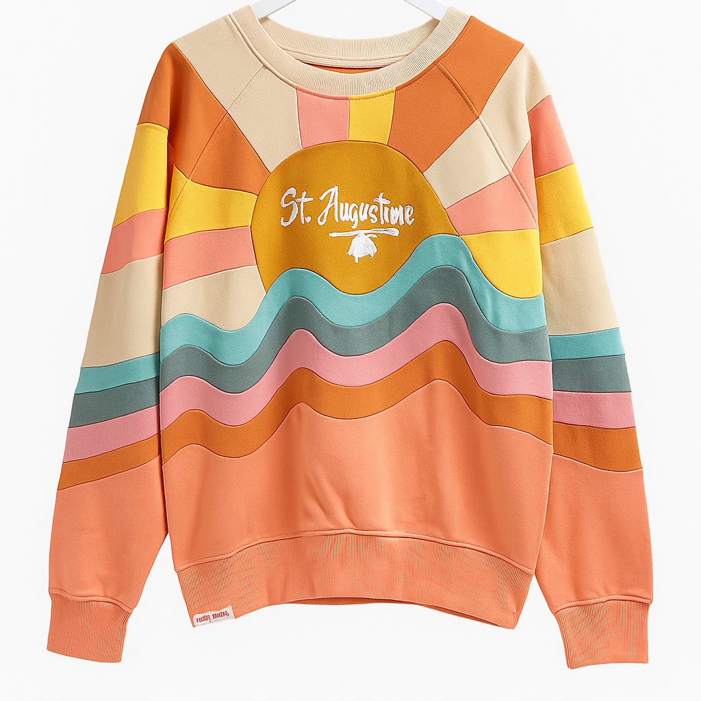 Colorful retro-style St. Augustine crewneck sweatshirt with embroidered text and wavy stripe design in warm sunset tones.
