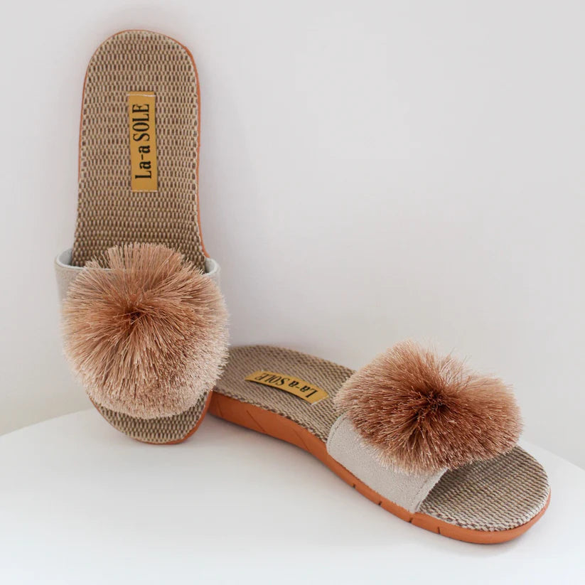 Gold Pom Pom Slide Sandals with playful pom pom and cushioned footbed