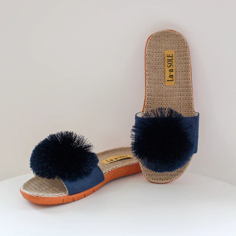 Navy Pom Pom Slide Sandals featuring bold pom pom accent and slip-on style