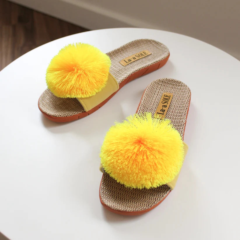Yellow Pom Pom Slide Sandals with cheerful pom pom and woven textured sole