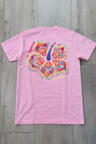 Back of pink St. Augustine Florida t-shirt with colorful hibiscus flower artwork, tropical accents, and St. Augustine/Florida text integrated into the design.