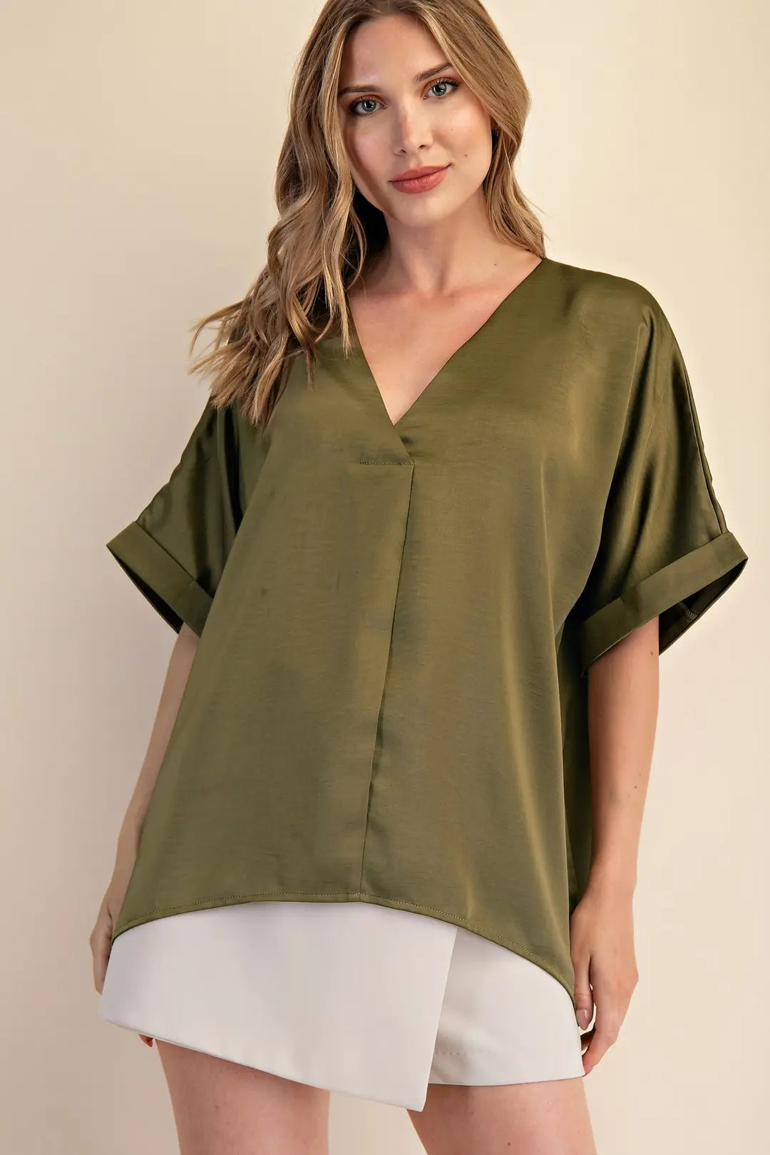 Elevate your wardrobe with the V-Neck Blouse in Olive, featuring a flowy silhouette and cuffed sleeves. Available at www.artsyabode.com
 or in store at Artsy Abode located in historic downtown St Augustine.
