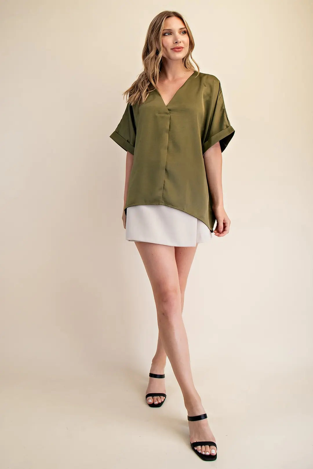 Elevate your wardrobe with the V-Neck Blouse in Olive, featuring a flowy silhouette and cuffed sleeves. Available at www.artsyabode.com
 or in store at Artsy Abode located in historic downtown St Augustine.