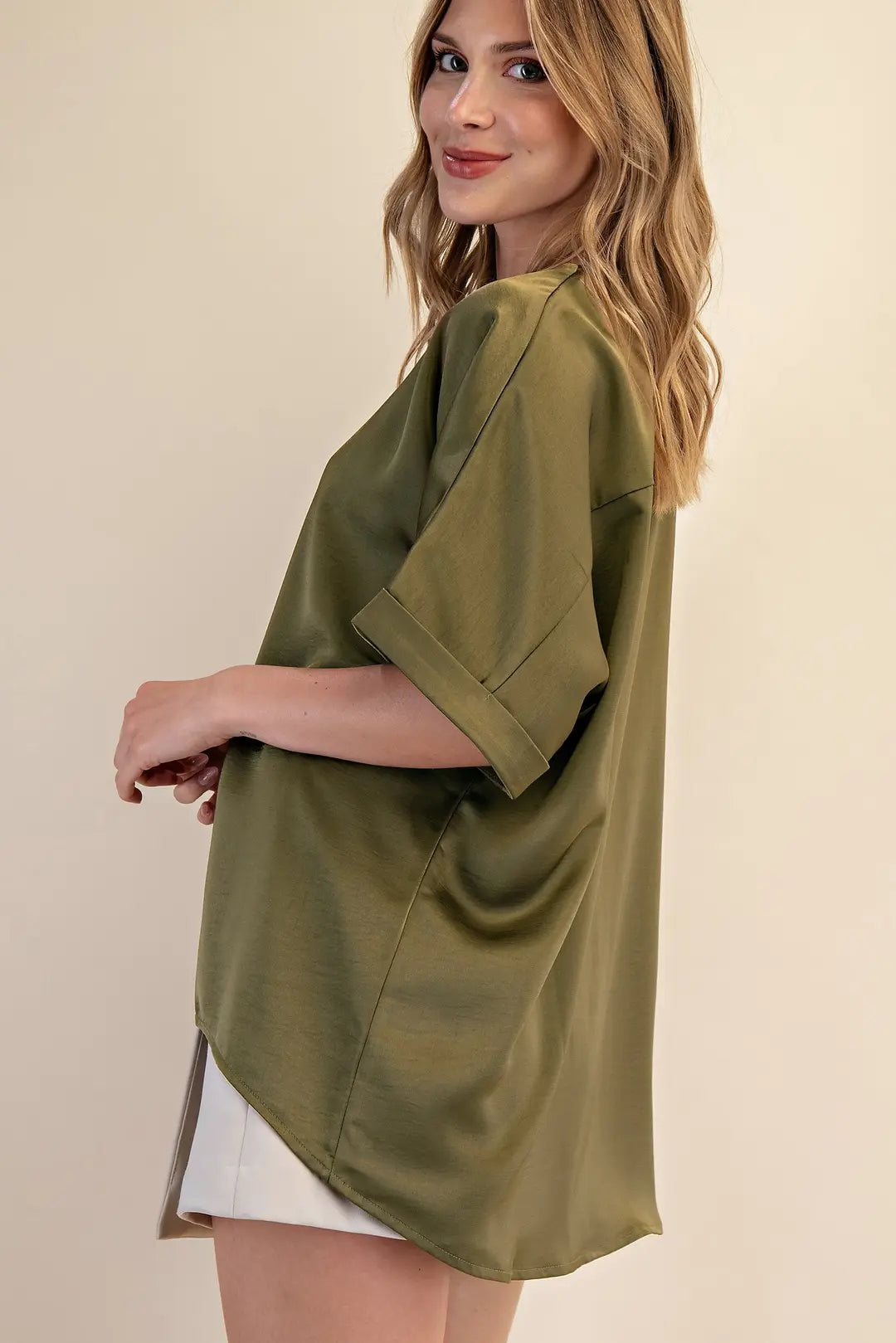 Elevate your wardrobe with the V-Neck Blouse in Olive, featuring a flowy silhouette and cuffed sleeves. Available at www.artsyabode.com
 or in store at Artsy Abode located in historic downtown St Augustine.